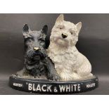 A 'Black and White' Scotch Whisky advertising group of two Scottie dogs, 10 1/2" w x 8" h.
