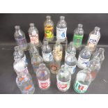 22 early glass milk bottles, all with advertising on, including KitKat, PG Tips, Brook Bond etc.