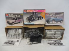 Three boxed 1:25 scale AMT plastic model kits, contents unchecked, but appear sealed, including a