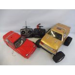 Two remote controlled cars and chassis' with two techniplus control systems.