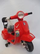 A battery operated model Vespa scooter.