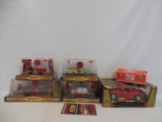 A selection of die-cast code 3 fire rescue trucks, and a Burago 1:21 scale model.
