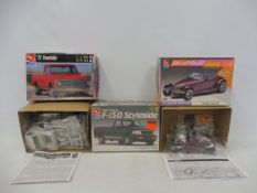 Three boxed 1:25 scale AMT plastic model kits, contents unchecked, but appear sealed, Plymouth