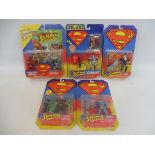 Five Kenner Superman carded figure and action sets, generally good condition.