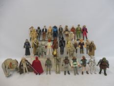 37 original release Star Wars figures some with capes, accessories and blasters to include Bobba-