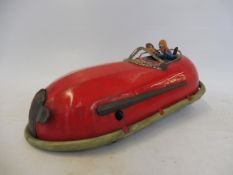 An early clockwork tinplate streamlined sci-fi inspired vehicle, with original figures inside.