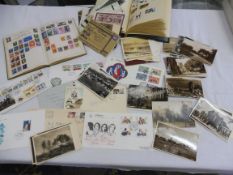 A small box of photographs and stamps.