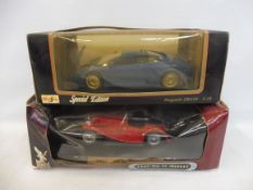 Two boxed 1:18 scale models comprising a 1947 MG Midget and a Bugatti.