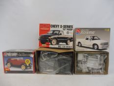 Three boxed 1:25 scale AMT plastic model kits, contents unchecked, but appear sealed, to include a