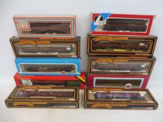 A group of oo gauge carriages, different makers to include the Royal Mail postal wagon.