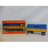 A boxed Tekno Scania truck with unboxed trailer.