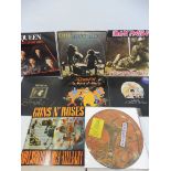 A small selection of rock LPs to include Queen, Guns and Roses, Iron Maiden and an original Can Tego