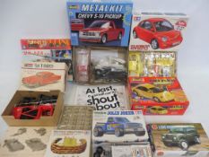A quantity of plastic model kits to include a 1958 T Bird, Airfix Land Rover etc., all unchecked.