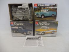 Three boxed 1:25 scale AMT plastic model kits, contents unchecked, but appear sealed, to include a