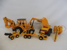 A selection of farm construction vehicles including the EBCC 499 tractor and excavator.