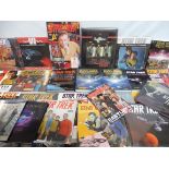 A box of Star Trek merchandise, books etc.,