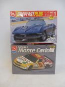 Two boxed 1:25 scale AMT plastic model kits, performance cars, to include The Kelloggs Monte Carlo.