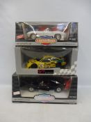 Three 1:18th scale models, to include two American muscle cars.