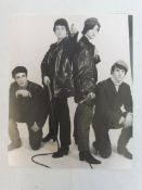 An original David Redfern photograph - image of the Kinks from the 1960s, with acreditation label to