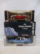 Three 1:18 scale models, to include the Mini Cooper, Land Rover Freelander etc.