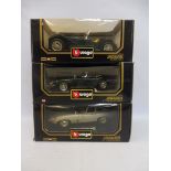 Three boxed Burago 1/18 scale models, all Jaguars of different eras.