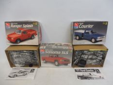 Three boxed 1:25 scale AMT plastic model kits, contents unchecked, but appear sealed, including a