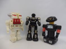 Three battery operated robots, circa 1970s/1980s.