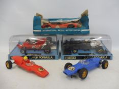 A quantity of boxed and loose Scalextric racing cars.