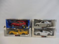 Four boxed 1/18 scale Ute models to include the Ford Escort Cosworth.