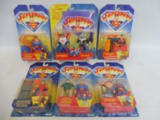 Five Kenner Superman carded figure and action sets, generally good condition.