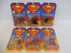 Five Kenner Superman carded figure and action sets, generally good condition.