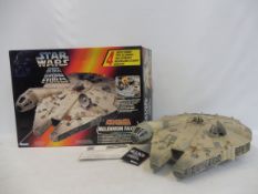 A boxed Kenner Star Wars electronic Millenium Falcon, appears in excellent condition.