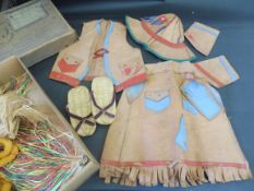 A selection of children's leather clothing, in the native American style.