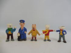 A selection of white metal painted figures from Rupert and Postman Pat.