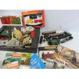 Two boxes of model railway items including locomotives, buildings and carriages, various scales.