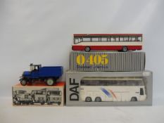 A Tekno DAF SB Series coach, an NZG Mercedes city bus and a Ziss MAN Oldtimer truck, all boxed.