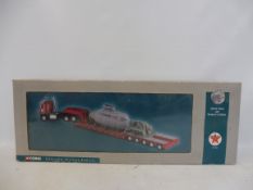 A boxed Corgi heavy haulage International tractor trailer and submarine.