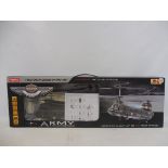 A boxed radio controlled Syma army Chinook helicopter.