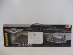 A boxed radio controlled Syma army Chinook helicopter.