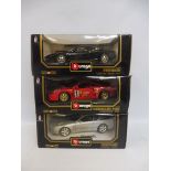 Three boxed Burago 1/18 scale models, all Ferraris of different eras.