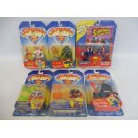 Five Kenner Superman carded figure and action sets, generally good condition.