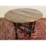 A 17th Century oak gateleg table with braganza feet, 36 x 38" open, 27 3/4" h.