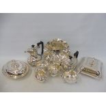 A silver plated four piece tea set, two silver plated lidded tureens, a pair of sauceboats and a