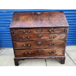 A George III mahogany bureau, of good colour, with fully fitted interior, above four long drawers to