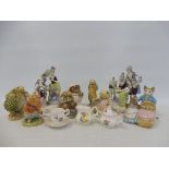 Two Continental porcelain figurines and a collection of mostly Beswick Beatrix Potter character