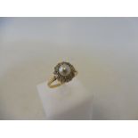 A cased 18ct gold diamond and pearl transitional ring, size M, 3.9g.