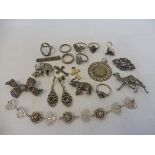A small tray of mostly silver and marcasite brooches, including two in the form of elephants and one