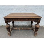 A Victorian oak single drawer side table with bold half fluted carved supports, 43 1/2" w x 31" h