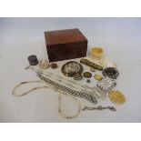 A quantity of assorted costume jewellery, plus a silver vesta case, in a burr wood box.