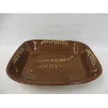 A giant 19th Century slipware dish, 21 1/2 x 18 1/2".